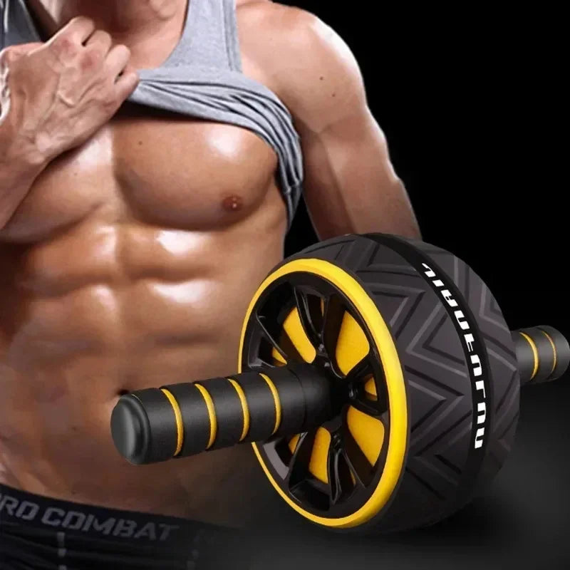 Dual-wheel ab roller with yellow rims and textured tread next to a person with toned abdominal muscles.